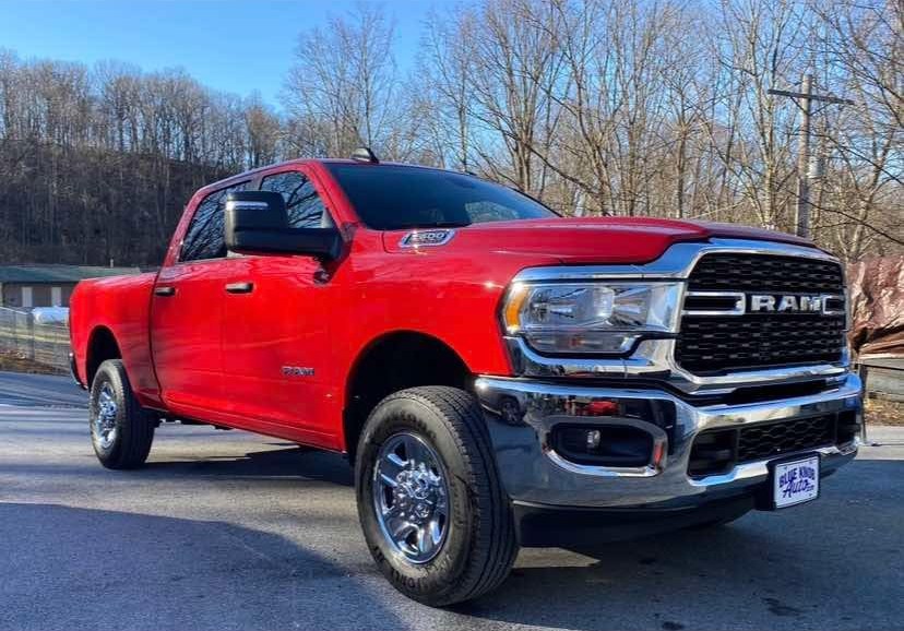 The Haul Hogs truck — a red Ram 2500 ready for a job